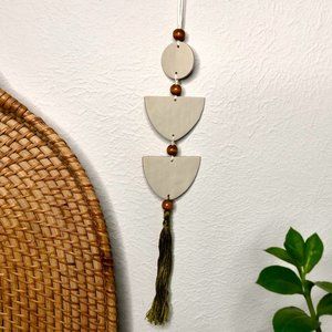 Hand Crafted Tan Clay Wall Art Hanging with green Tassel and wooden beads